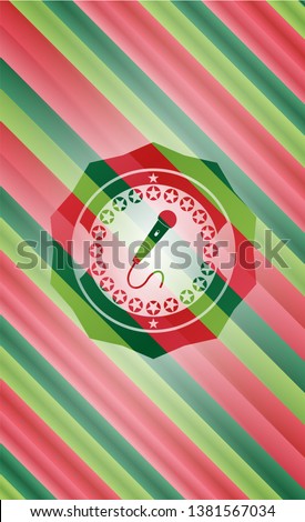 microphone icon inside christmas badge background.