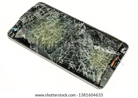 Mobile phone with a badly shattered screen after a serious fall.