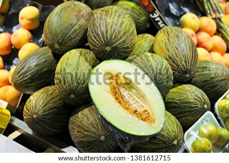 melons in the fruit shop of the Triana market, Seville, Spain