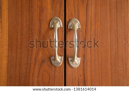 close up wooden windows and steel handles