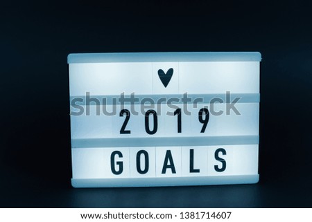 Photo of a light box with text, 2019 GOALS, dark background