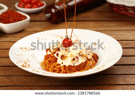 Delicious spaghetti with tomato sauce and cheese served