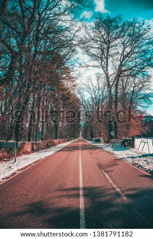 photo in which you can see the road with snow and an incredible view