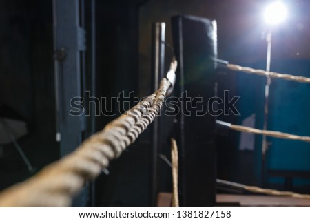 Vintage braided Boxing Ropes in the gym for martial arts with light from the window, MMA fighting, close-up