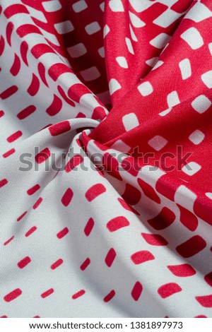 texture background pattern. silk fabric with a pattern of red squares on a white background. This is a heavy square 100% polyester pattern that fits perfectly with modern