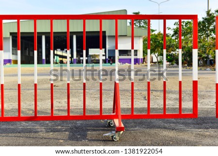 Red steel barrier at warehouse.