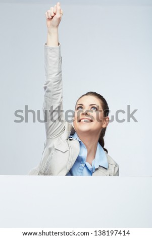 Successfull young business woman portrait out the blank white banner.Female happy model.