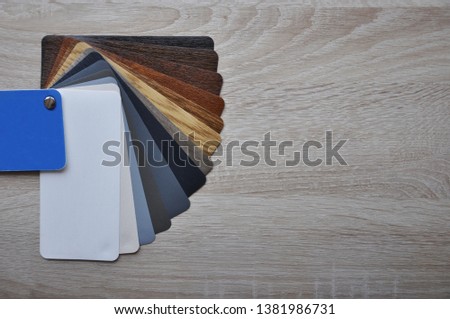 Palette guide, fan, catalogue with wooden textures on light wooden background