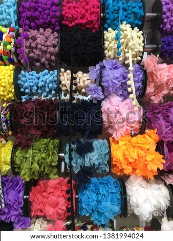 Colorful diy materials, lots of different laces, beads, necklace, handmade, pom poms, green pink red yellow colors, craft, diy sewing materials