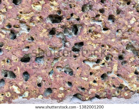 Small red stone texture for background abstract