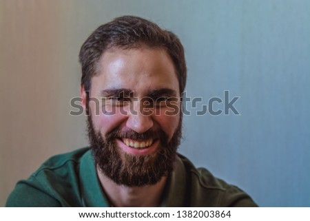 Various emotions on a face at the young bearded European man. Different mood