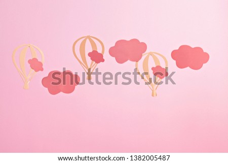 Mock up with pink paper clouds and flying balloons over the pink pastel background 