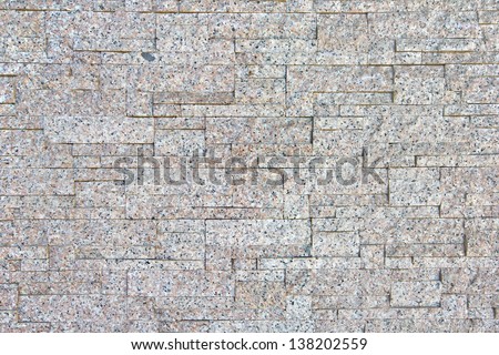 Real granite stone texture and rectangle pattern in top view. Natural material with beige gray abstract texture of mineral, quartz. Rough surface for decorative wall at interior exterior building.