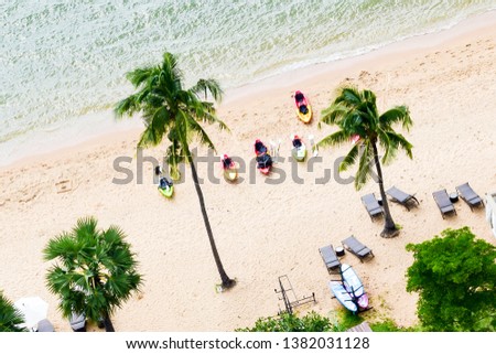 Travel agency background theme. Tourism photo for business. Beautiful tropical island sands. Coconut palm trees.