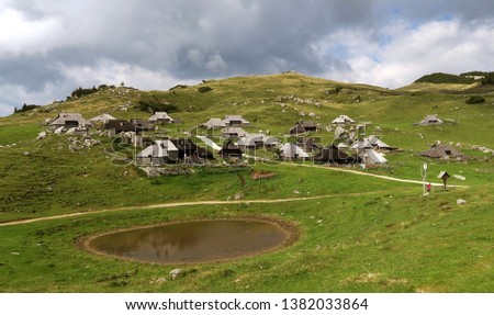 Mountain with shepherd's huts in the pastures of Velika planina (Great plains) in Slovenia.