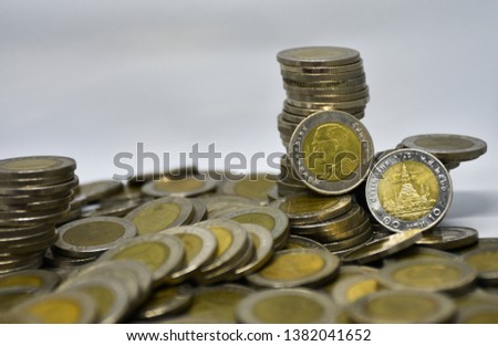 many Thai coin 10 baht on white background.