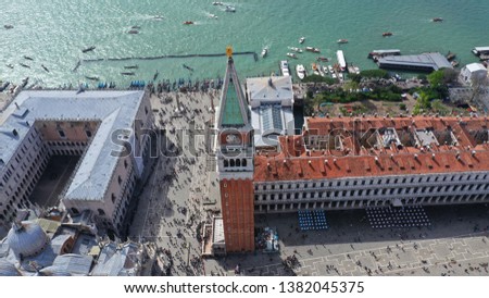 Aerial drone panoramic photo of iconic Saint Mark's square or Piazza San Marco featuring Doge's Palace, Basilica and Campanile, Venice, Italy