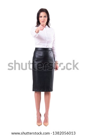 Strict angry teacher or business woman looking at camera pointing finger at you. Full body isolated on white background. 