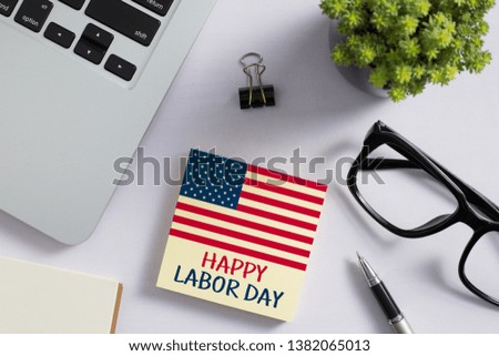 Happy Labor Day on the sticky note paper.