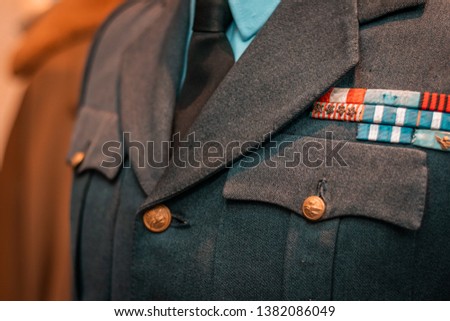 Details of historical Italian military uniforms. Grades and patches on high quality fabrics. Vintage style suits, European taste for elegance. 