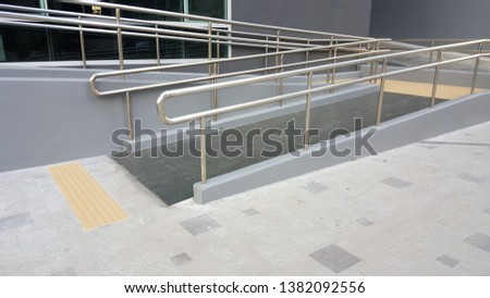 Wheelchair ramp for wheelchair disabled Royalty-Free Stock Photo #1382092556