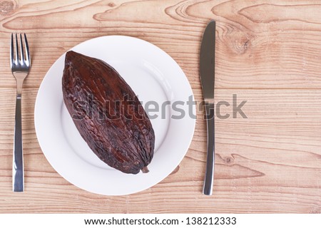 cocoa fruit on wooden background