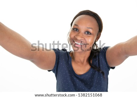 Close up portrait of a smiling young african woman make selfie phone