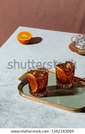 Negroni, an Iba cocktail, with 1/3 gin, 1/3 bitter, 1/3 vermut, in luxury pop style, rich and colorful. Royalty-Free Stock Photo #1382183084