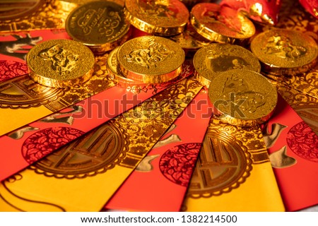Chinese Pig New Year red packets and coins made by chocolate