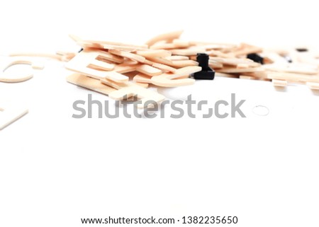 Scramble wooden letters over white background