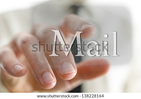 Closeup of businessman hand pressing Mail icon on a touch screen interface.
