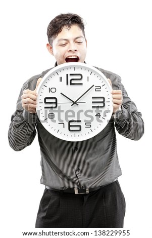 Time concept,Businessman holding big clock and give the expression on his face