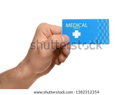 Man holding business card isolated on white, closeup. Medical service