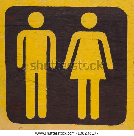 The male and female figure that is the toilet sign in yellow color