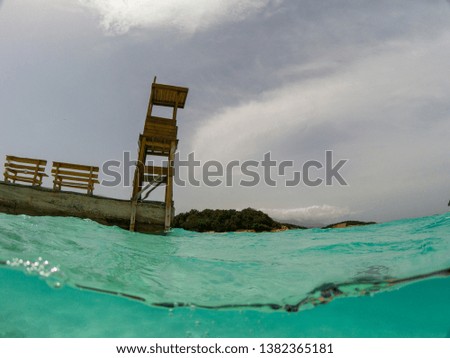 picture taken in Ksamil Albania in the albanian riviera. in the picture its the beach safety tower from an underwater prespective