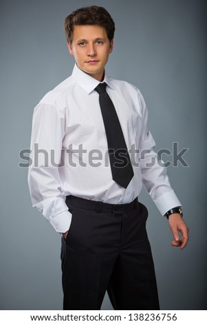 confident businessman in white shirt and tie