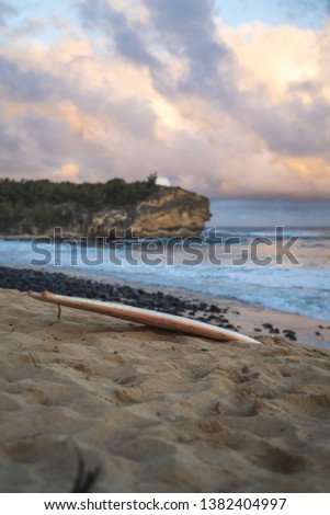 Perfect sunset surfboard session in Poipu Kauai of Hawaii