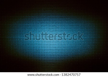 On a dark blue background to a small point a blurred volume cloud of light