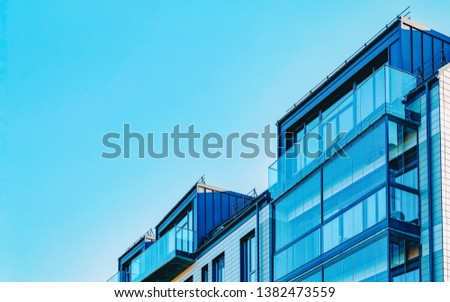 Facade of a modern residential apartment house building. Including place with copy space
