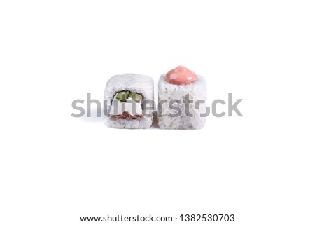 Traditional fresh japanese sushi rolls isolated on white background. Roll "Philadelphia with salmon"
Ingredients: Salmon, spicy sauce, soft cheese, cucumber, nori, rice