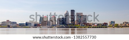 The City of Louisville, in the state of Kentucky, United States of America, as seen from the Indiana river bank of the Ohio River Royalty-Free Stock Photo #1382557730