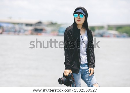 Portrait, photographer wearing cap and sunglasses 
