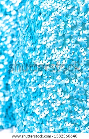 Fabric with sequins and sequins of bright colors. Fashion glitter fabric, sequins. Shiny surface