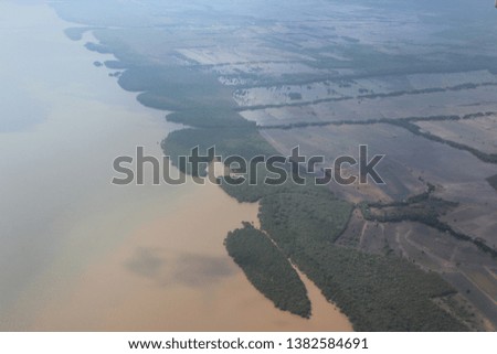 the border between the land and the sea of the island of Borneo appears from above the sky
