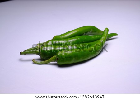 beautiful green chilli picture on white background