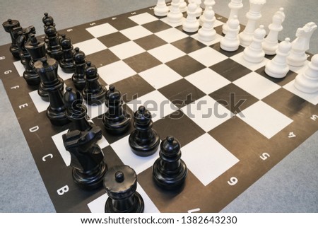 Black and white photo with a picture of a chess Board and chess pieces, chess pieces on a chess Board