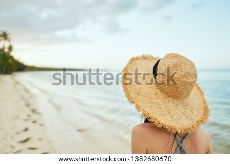 woman in a hat on the sea nature trip                              