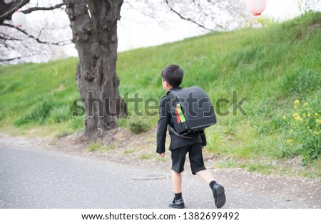 Elementary school boy going to school