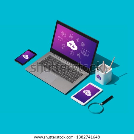 Cloud computing, data transmission, storage and backup concept: isometric computer, servers and hard disks on a desktop