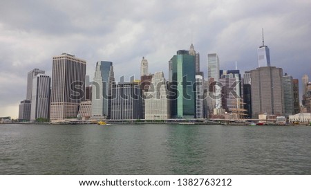 The Financial District in Lower Manhattan viewed from Brooklyn Bridge Park - New York City